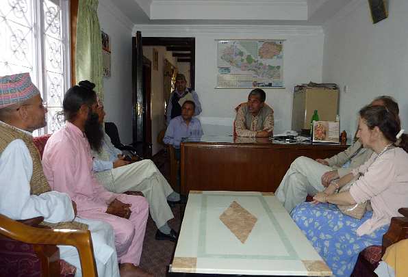 11-Pashupatinath Trust Meeting - 11.jpg - Deepak Baskota, Raja Kingsley, and Mother of the Domain Leslie meeting with the head of the Pashupatinath Trust, the group that has been appointed by the government to look after the land associated with the Pashupatinath Temple.